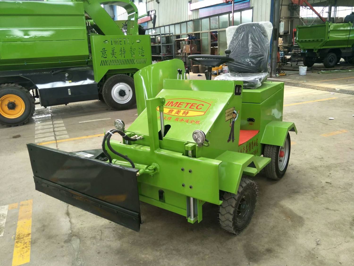feed pusher for cow farms for pushing feeding materials